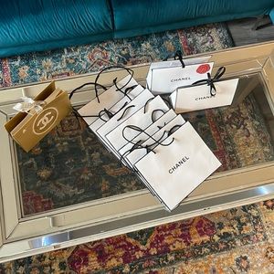 Authentic Chanel gift bags. Most are 7/10 condition. Includes 10 gift bags.